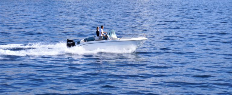 man and woman on small powerboat in open water